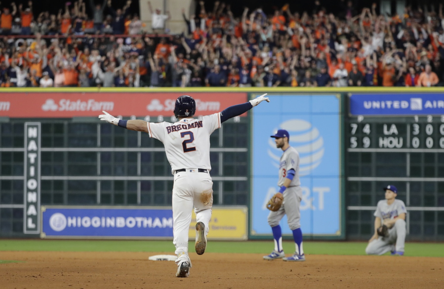 Houston Astros’ Alex Bregman reacts after hitting in the game-winning run during the 10th inning of Game 5 of baseball’s World Series against the Los Angeles Dodgers Monday, Oct. 30, 2017, in Houston. The Astros won 13-12 to take a 3-2 lead in the series. (AP Photo/David J.