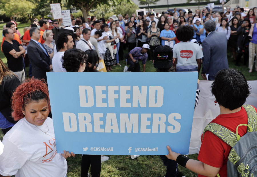 In this Sept. 26, 2017 photo, immigrant rights supporters gather at the U.S. Capitol in Washington. Just 1 in 5 Americans want to deport young immigrants brought to the United States illegally as children, a group now at the center of a politically fraught debate between the White House and Congress. Americans also have largely negative opinions about President Trump’s signature immigration pledge, according to a new poll by The Associated Press-NORC Center for Public Affairs Research.
