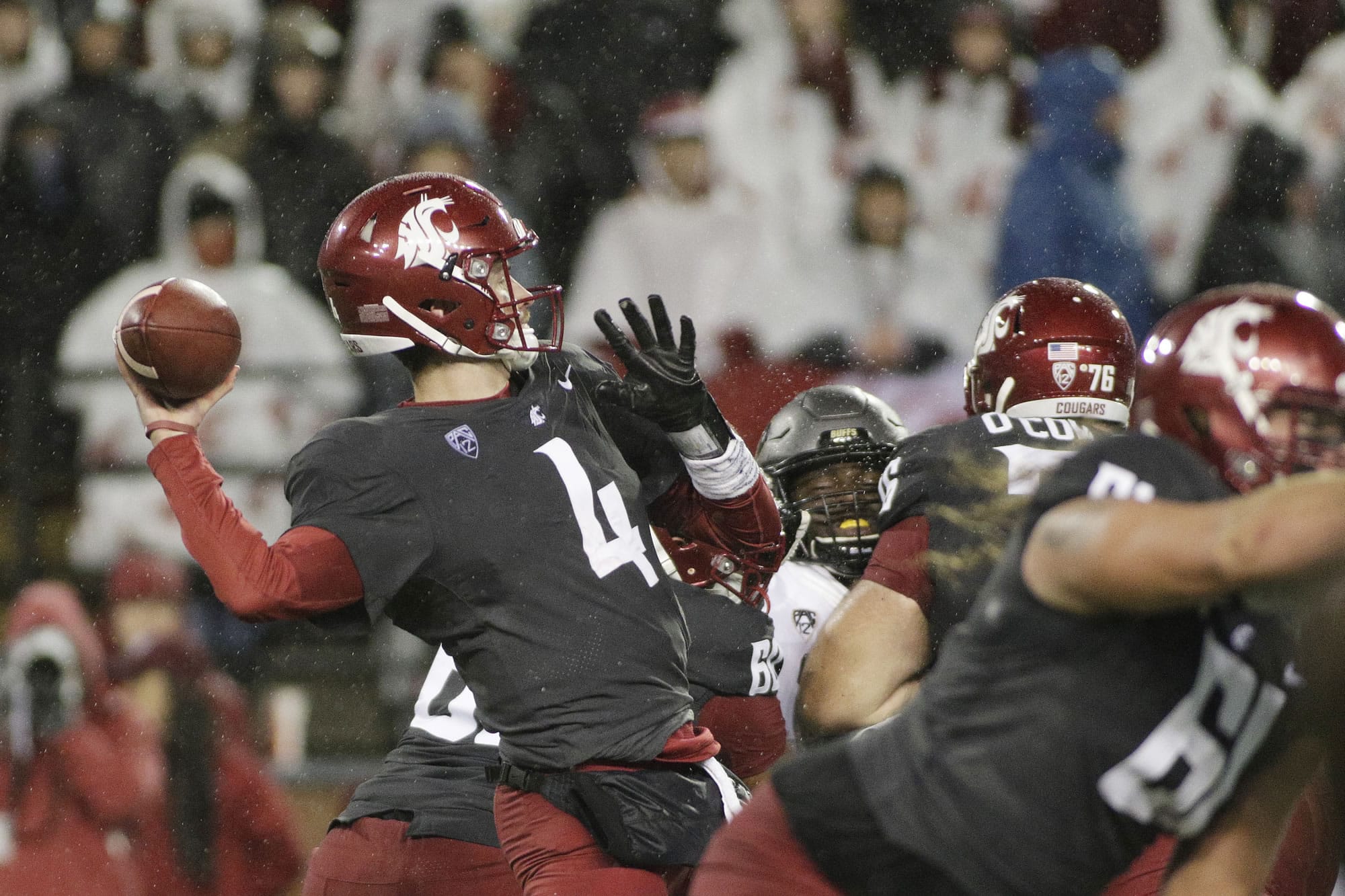 Washington State quarterback Luke Falk (4) throws a pass during the first half of an NCAA college football game against Colorado in Pullman, Wash., Saturday, Oct. 21, 2017.