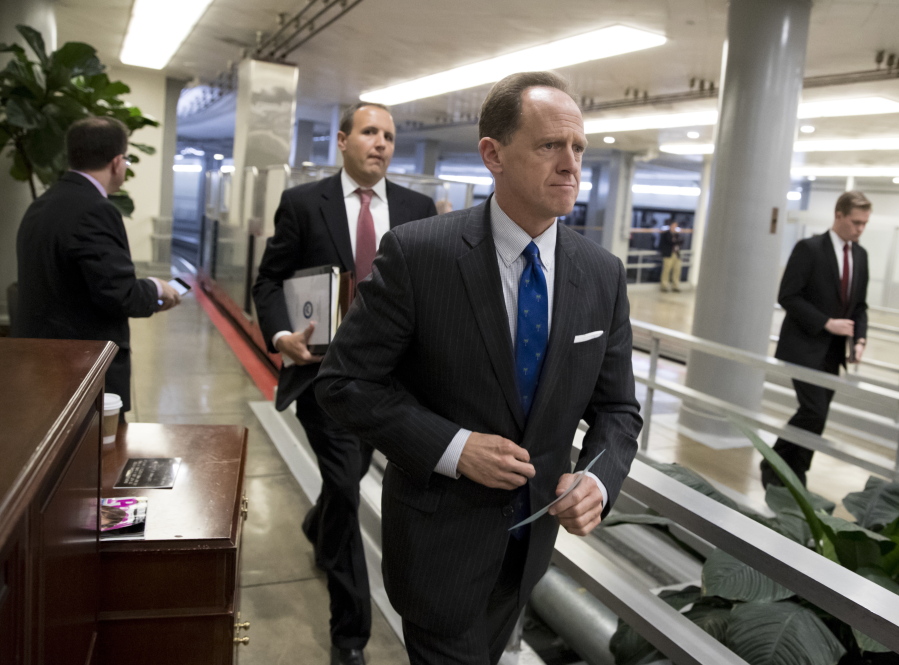 Sen. Pat Toomey, R-Pa., a member of the Senate Budget Committee, heads to the floor during a series of votes at the Capitol in Washington, Thursday, Oct. 19, 2017. (AP Photo/J.