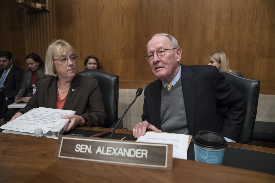Sen. Patty Murray, D-Wash., the ranking member, and Sen. Lamar Alexander, R-Tenn., chairman of the Senate Health, Education, Labor, and Pensions Committee, meet before the start of a hearing on Capitol Hill in Washington on Wednesday the morning after they reached a deal to resume federal payments to health insurers that President Donald Trump had halted. (AP Photo/J.