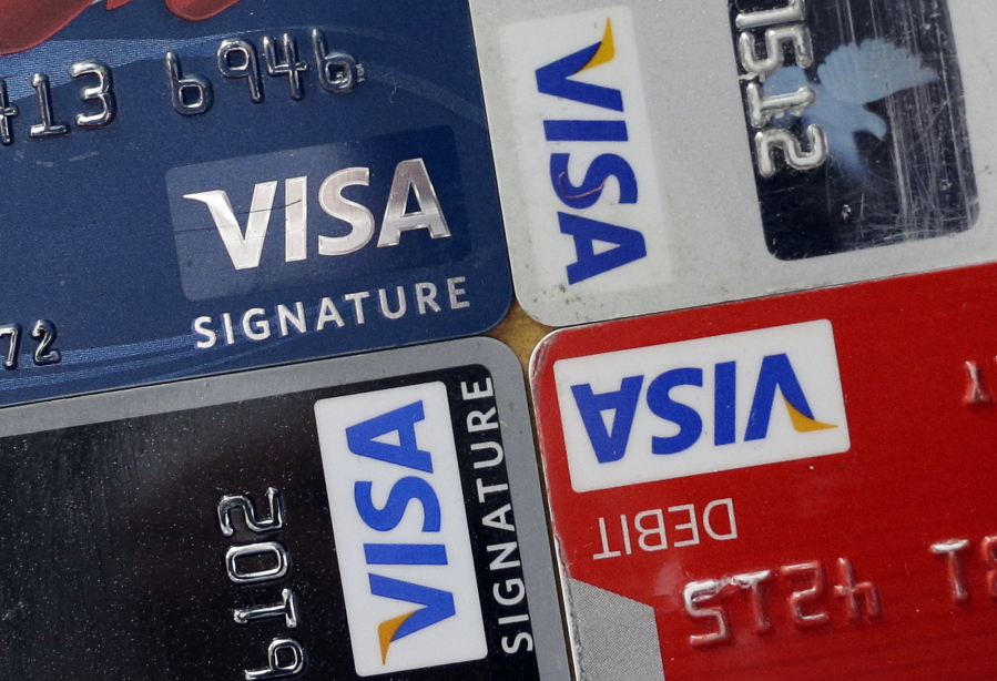 Credit and debit cards are displayed for a photographer in Baltimore. Payment processing giant Visa is launching a platform to allow banks to integrate various types of biometrics, such as your fingerprint, face, voice, etc., into approving credit card applications and payments. It could lead to customers having to take a selfie to verify they actually made an online purchase or applied for a particular credit card.
