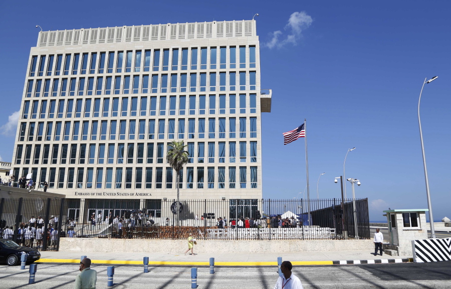 FILE - In this Aug. 14, 2015, file photo, a U.S. flag flies at the U.S. embassy in Havana, Cuba. The Associated Press has obtained a recording of what some U.S. Embassy workers heard in Havana, part of the series of unnerving incidents later deemed to be deliberate attacks.