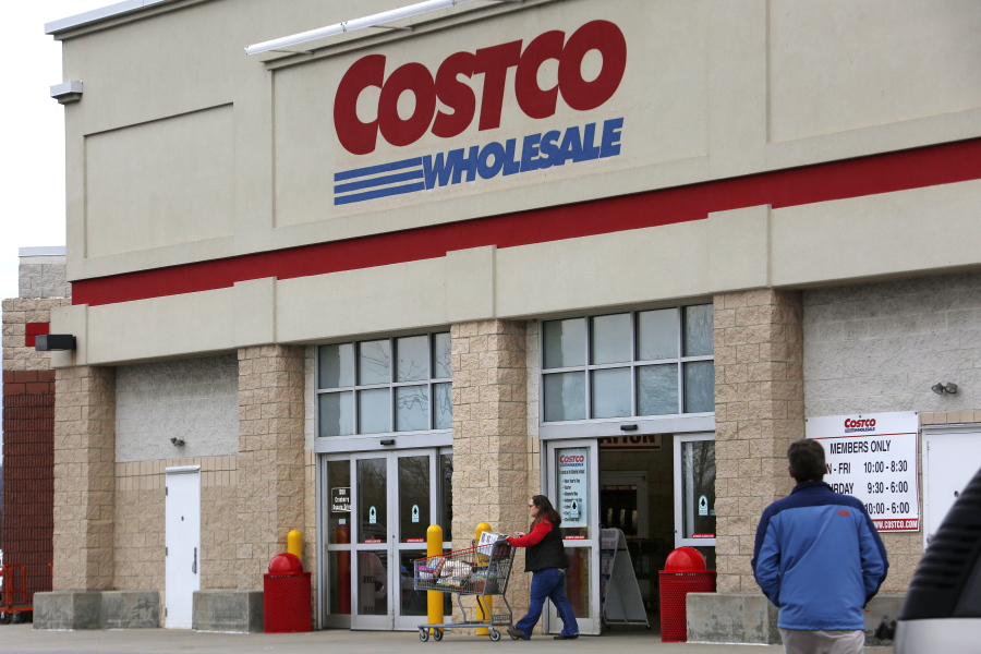 FILE - In this Wednesday, Feb. 8, 2017, file photo, a shopper leaves a Costco Wholesale store in Cranberry Township, Pa. Costco Wholesale Corp. reports earnings Thursday, Oct. 5, 2017. (AP Photo/Gene J.