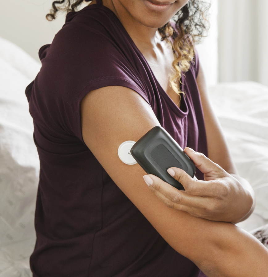 A model demonstrates the use of the company’s FreeStyle Libre flash glucose monitoring device. The Food and Drug Administration has approved the device, which continuously monitors diabetics’ blood sugar levels without requiring backup finger prick tests. Current models require users to test a drop of blood twice daily to calibrate, or adjust, the monitor.
