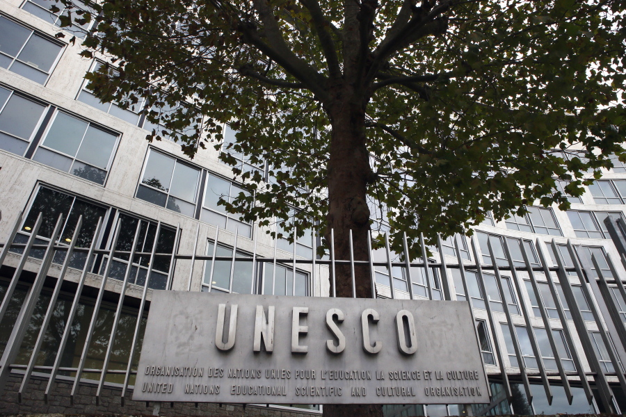 The United Nations Educational Scientific and Cultural Organization logo is pictured on the entrance at UNESCO’s headquarters in Paris. U.S. officials have told The Associated Press that the United States is pulling out of UNESCO, after repeated criticism of resolutions by the U.N. cultural agency that Washington sees as anti-Israel.