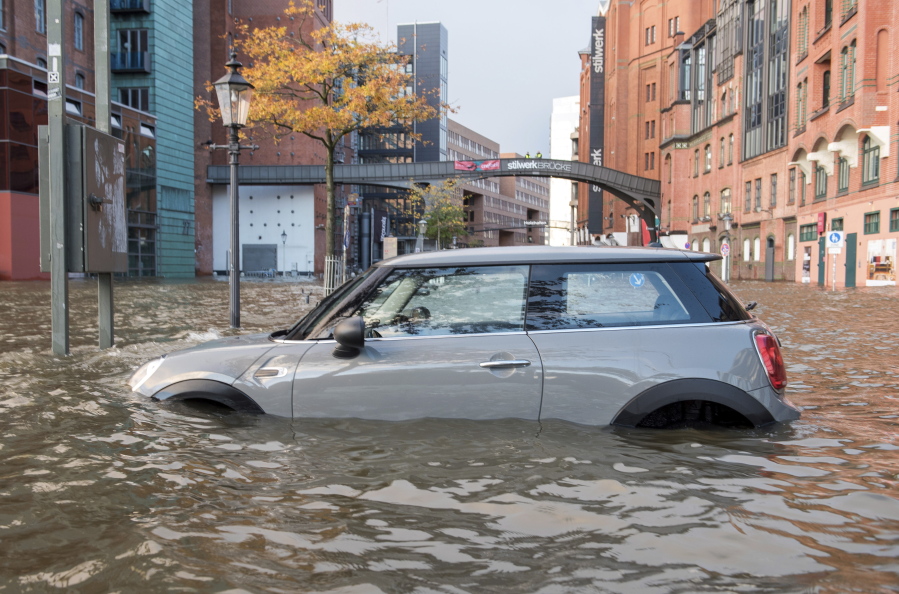 A car stands in the floods near a fish market in Hamburg, Germany, on Sunday.