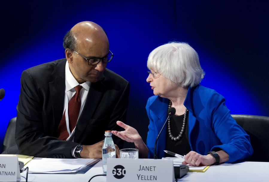 U.S. Federal Reserve Chair Janet Yellen speaks with G30 Chairman Singapore Deputy Prime Minister Tharman Shanmugaratnam during the G30 International Banking Seminar, at Inter-American Development Bank headquarters in Washington, Sunday.