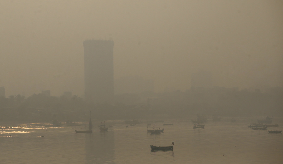Morning smog envelops the skyline in Mumbai, India, on Friday. Environmental pollutants are killing at least 9 million people and costing the world $4.6 trillion a year, a toll exceeding that of wars, smoking, hunger or natural disasters. One out of every six premature deaths in the world in 2015, about 9 million, could be attributed to disease from toxic exposure, according to a major study released Thursday in The Lancet medical journal. Asia and Africa are the regions putting the most people at risk, the study found, while India tops the list of individual countries.