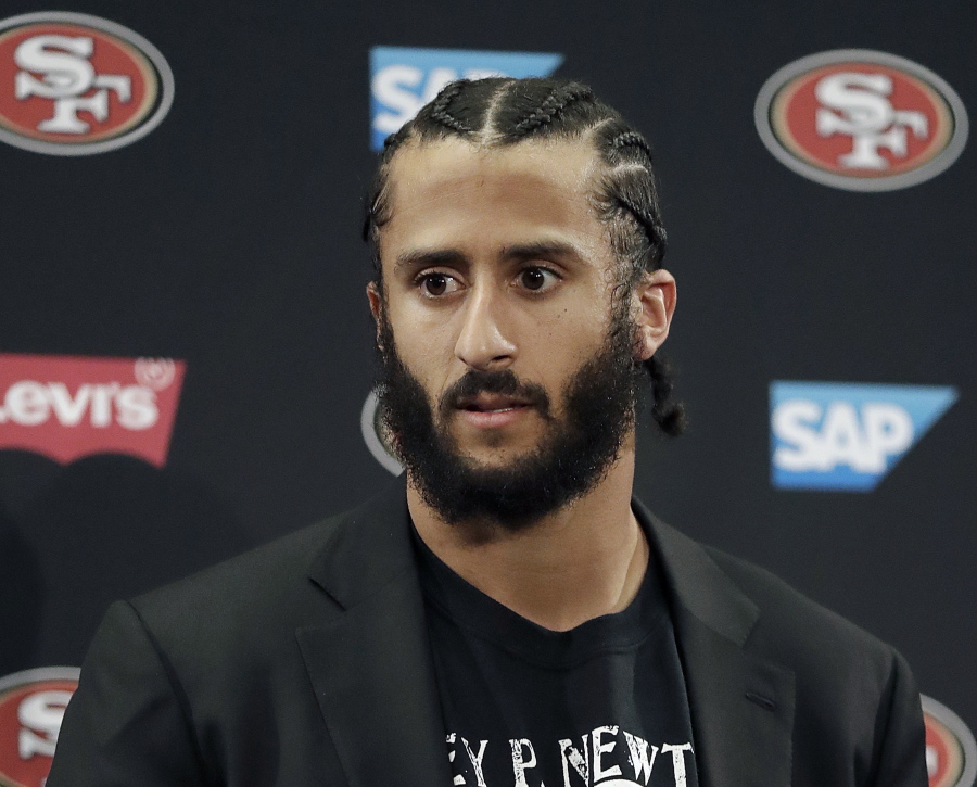 Then San Francisco 49ers quarterback Colin Kaepernick speaking at a news conference after the team’s NFL football game against the Seattle Seahawks in Santa Clara, Calif. NFL spokesman Joe Lockhart says the league expects Colin Kaepernick to be invited to the next meeting between owners and players to discuss social justice initiatives. Lockhart adds that the meeting probably will take place next week.