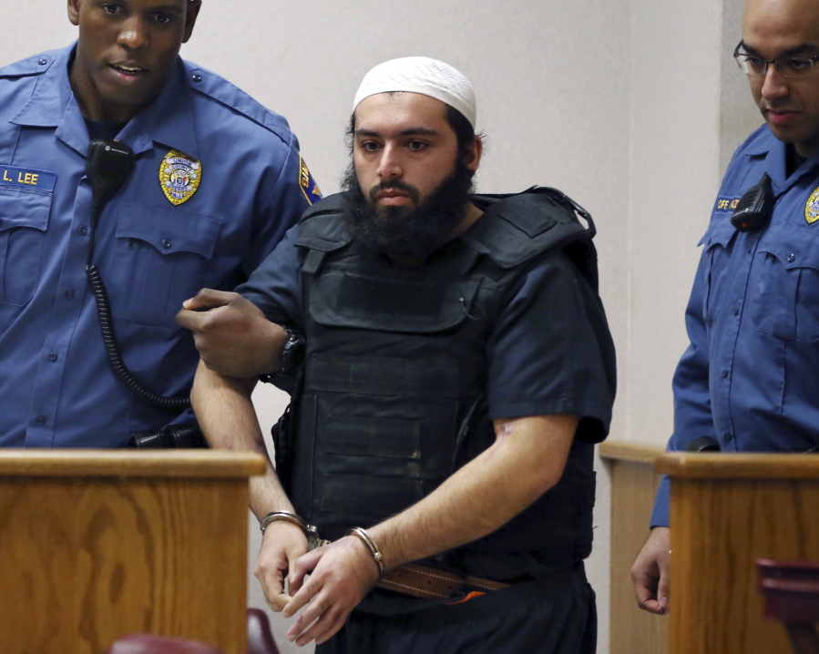 Ahmad Khan Rahimi, the man accused of setting off bombs in New Jersey and New York in September is led into court in Elizabeth, N.J. Prosecutors said the case against Rahimi relies on video from security cameras in storefronts and businesses all over New Jersey and New York.