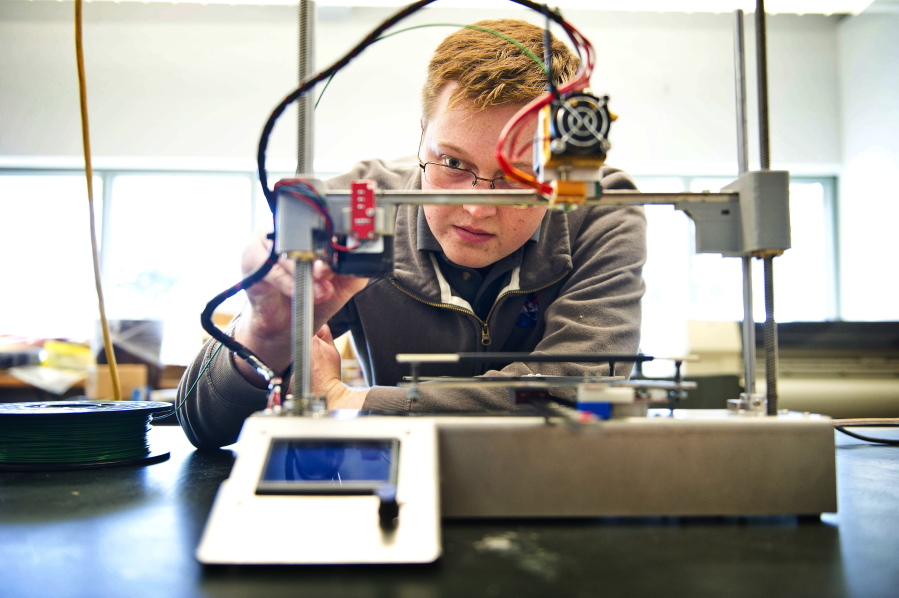 Walla Walla University student Austin Nordman prepares before a demon-stration of the 3-D printer he designed. Nordman, who graduates in December, has accepted a position with NASA.
