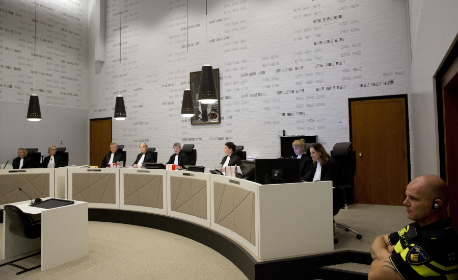 Presiding Judge Renckens, center, opens the court session in The Hague, Netherlands, Monday in the case against a Dutch national of Ethiopian descent for alleged war crimes committed during the 1970’s regime in Ethiopia.