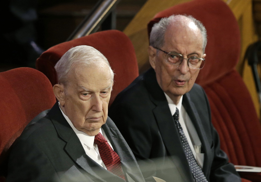 FILE - This July 10, 2015, file photo, shows Senior Mormon leader Robert D. Hales, right, and Richard G. Scott, left, attending the memorial service for Mormon leader Boyd K. Packer at the Tabernacle on Temple Square in Salt Lake City. Senior Mormon leader Robert D. Hales has died at the age of 85. Church spokesman Eric Hawkins said in a statement that Hales died Sunday, Oct. 1, 2017, in a Salt Lake City hospital surrounded by his wife and family.