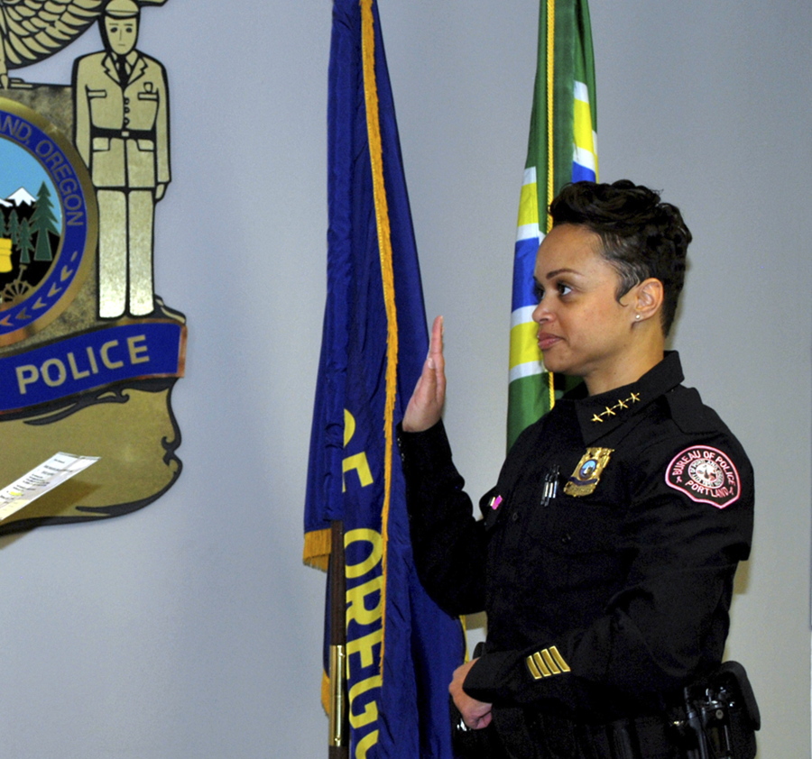 This photo provided by the Portland Police bureau shows Danielle Outlaw as she is sworn in as Portland Police Chief in Portland, Ore., Monday. Outlaw is the third woman, and first black woman, to become chief of police in Oregon’s largest city.