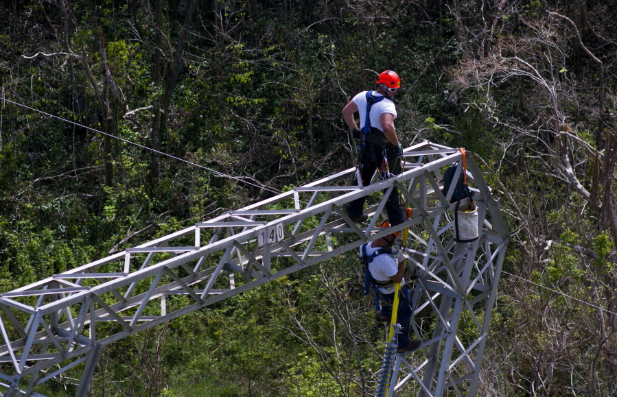 Whitefish Energy Holdings workers restore power lines Oct. 15 damaged by Hurricane Maria in Barceloneta, Puerto Rico. The Federal Emergency Management Agency said Friday, it had no involvement in the decision to award a $300 million contract to help restore Puerto Rico’s power grid to a tiny Montana company in Interior Secretary Ryan Zinke’s hometown. FEMA said in a statement that any language in the controversial contract saying the agency approved of the deal with Whitefish Energy Holdings is inaccurate.
