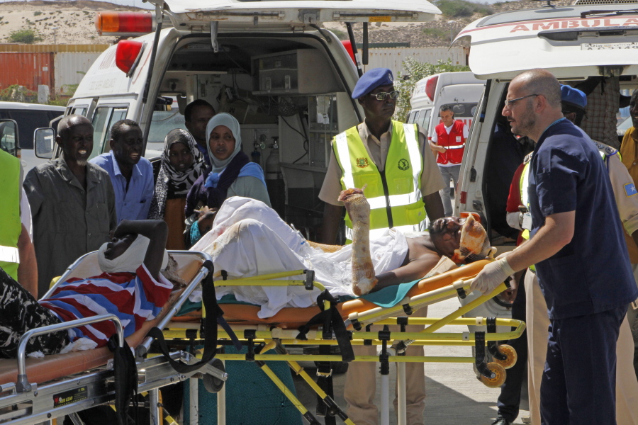 Turkish doctors transport a critically wounded man on a stretcher to a waiting Turkish air ambulance to airlift injured patients for treatment in Turkey, in Mogadishu, Somalia, on Monday. The death toll from Saturday’s truck bombing in Somalia’s capital now exceeds 300, the director of an ambulance service said Monday, as the country reeled from the deadliest single attack.