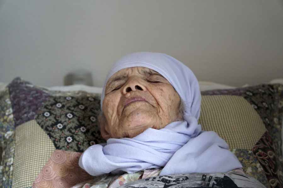Afghan refugee Bibihal Uzbeki 106-year-old as she lies in bed in Hova, Sweden. Uzbeki who made a perilous journey to Europe in 2015 that involved her son and grandson carrying her through mountains, deserts and forests has finally been granted temporary shelter in the Scandinavian country. The Migration Court of Appeal said Wednesday Oct.