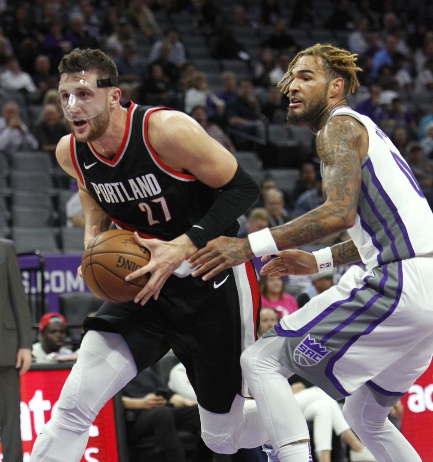 Portland Trail Blazers center Jusuf Nurkic (27) drives past Sacramento Kings defender Willie Cauley-Stein (00) during the first half of an NBA preseason basketball game in Sacramento, Calif., Monday, Oct. 9, 2017.