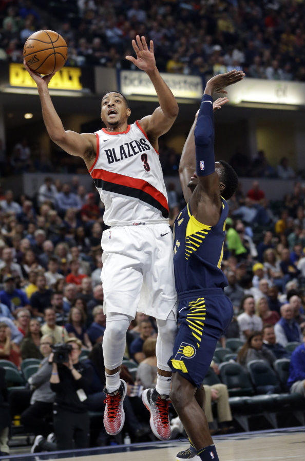 Portland Trail Blazers guard CJ McCollum (3) shoots over Indiana Pacers guard Victor Oladipo (4) during the second half of an NBA basketball game in Indianapolis, Friday, Oct. 20, 2017. The Trail Blazers beat the Pacers 114-96.
