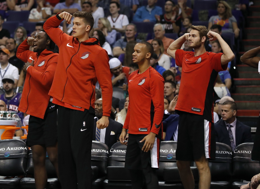 Players on the Portland Trail Blazers bench celebrate during the second half of the team’s NBA basketball game against the Phoenix Suns, Wednesday, Oct. 18, 2017, in Phoenix.