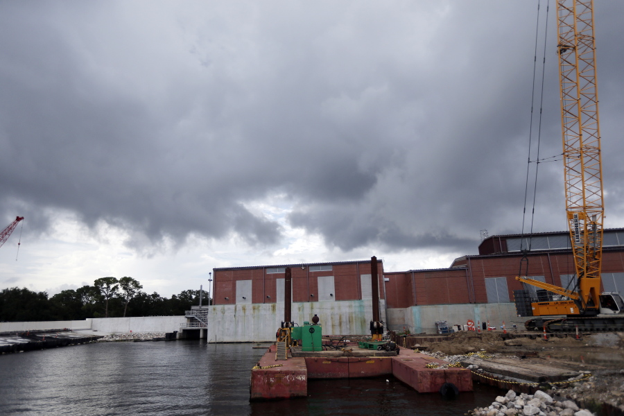 Rain clouds gather over a pumping station at Marconi Drive and lake Pontchartrain in New Orleans. Flood-weary New Orleans braced Thursday for the weekend arrival of Tropical Storm Nate, forecast to hit the area Sunday morning as a weak hurricane that could further test a city drainage system in which weaknesses were exposed during summer deluges.