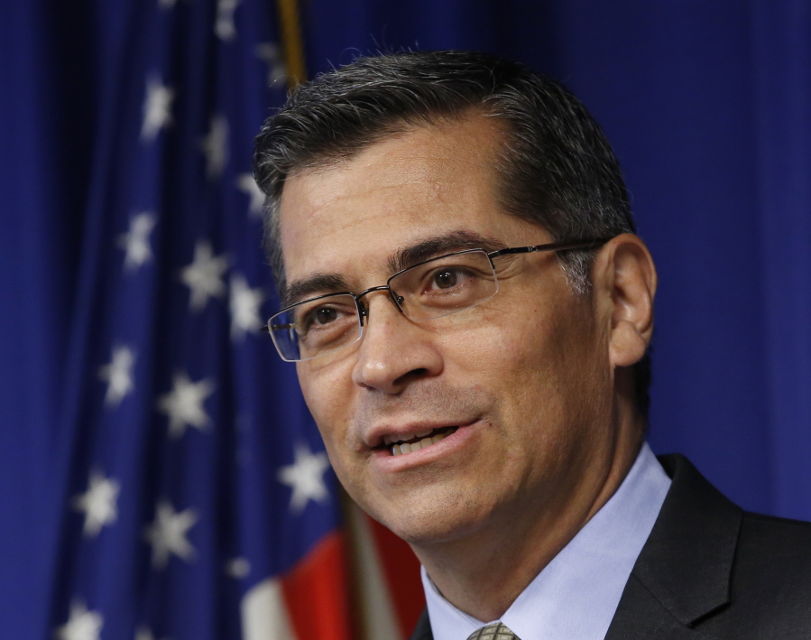 In this May 3, 2017, file photo, California Attorney General Xavier Becerra answers a question during a news conference in Sacramento, Calif. The top lawyers for 19 states will urge a federal judge Monday to force President Donald Trump’s administration to pay health care subsidies he abruptly cut off earlier this month. State attorneys general, led by Becerra, argue the monthly payments are required under former President Barack Obama’s health care law, and cutting them off will harm consumers.