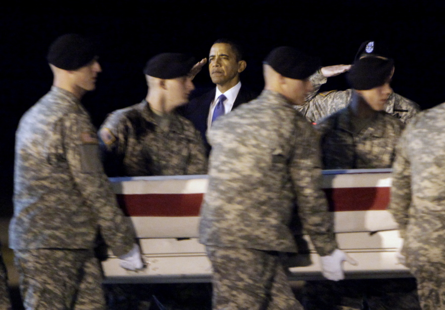 President Barack Obama, center, salutes as an Army carry team carries the transfer case containing the remains of Sgt. Dale R. Griffin of Terre Haute, Ind., during a dignified transfer event at Dover Air Force Base, Del. President Donald Trump is claiming his predecessors did not sufficiently honor the nation’s fallen. Obama’s office says Trump is “unequivocally wrong,” and says Obama engaged families of the fallen and wounded warriors through his presidency — through calls, letters, visits to Arlington National Cemetery, regular meetings with Gold Star families and more.