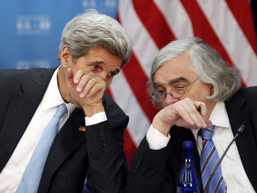 Secretary of State John Kerry, left, speaks May 4, 2016 with Secretary of Energy Ernest Moniz at the State Department in Washington. Former Obama administration officials who played central roles in brokering the Iran nuclear agreement are scheduled to brief congressional Democrats on the merits of the international accord as President Donald Trump prepares to announce a decision that could lead to an unraveling of the pact.
