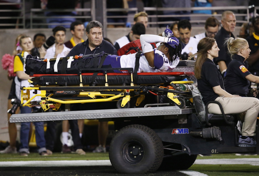 Washington defensive back Jordan Miller (23) is carted off the field due to injury during the second half of an NCAA college football game against Arizona State Saturday, Oct. 14, 2017, in Tempe, Ariz. Arizona State defeated Washington 13-7. (AP Photo/Ross D.