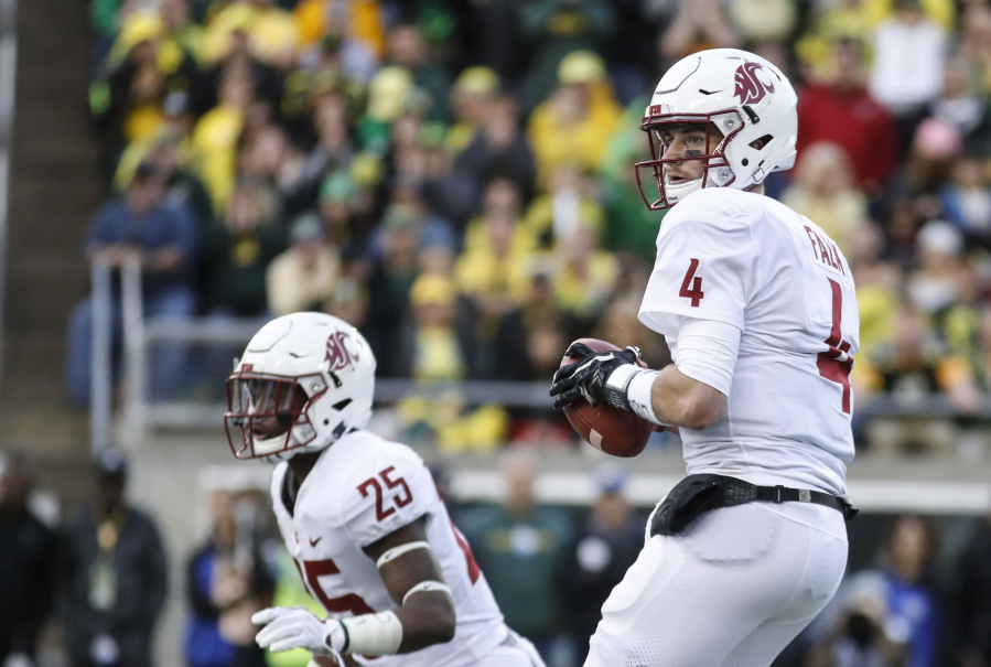 Washington State quarterback Luke Falk (4) looks for a receiver against Oregon in an NCAA college football game Saturday, Oct. 7, 2017 in Eugene, Ore.
