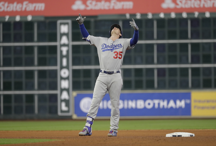 Los Angeles Dodgers’ Cody Bellinger reacts after hitting a double during the seventh inning of Game 4 of baseball’s World Series against the Houston Astros Saturday, Oct. 28, 2017, in Houston. (AP Photo/David J.