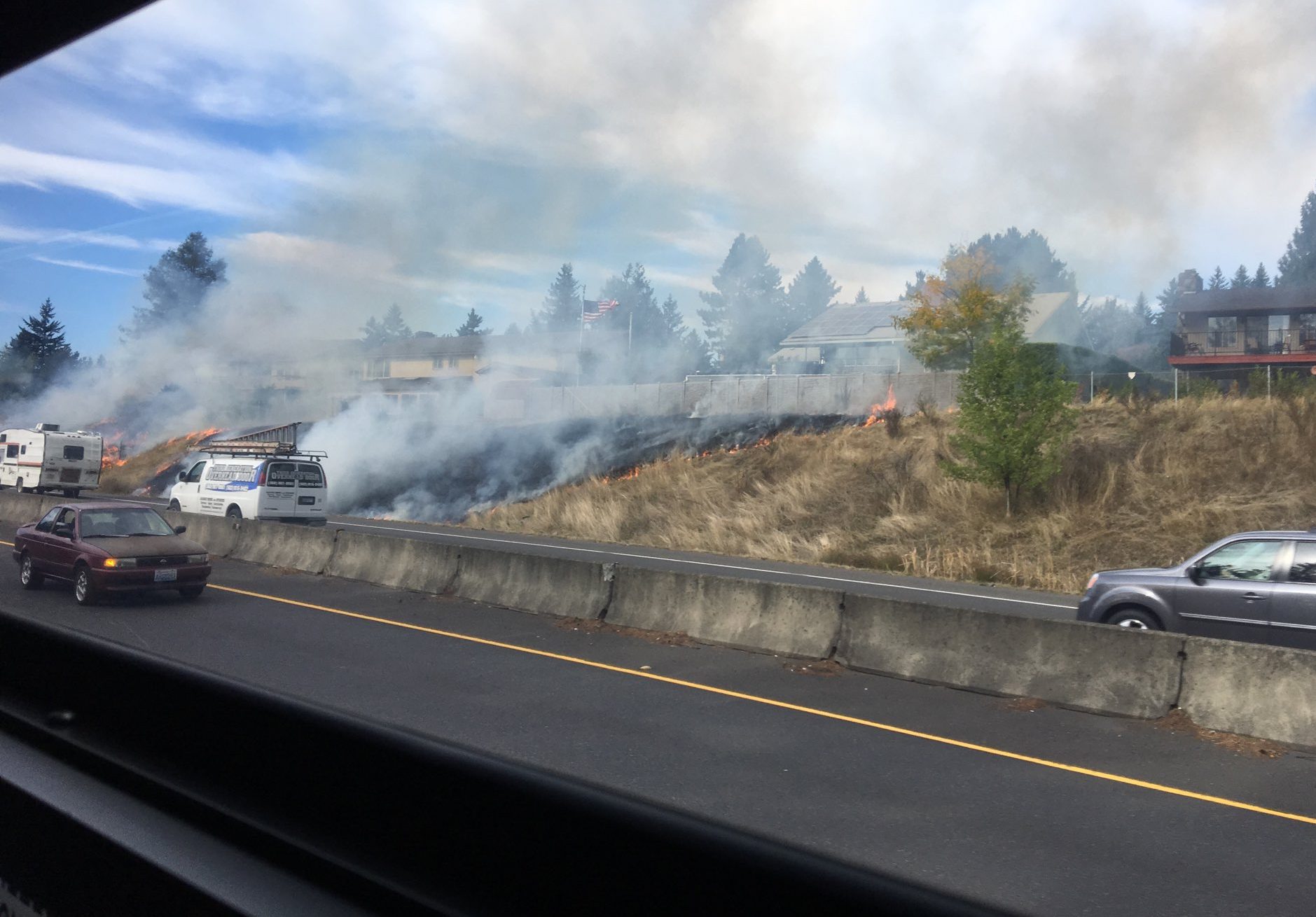A brush fire on the north shoulder of state Highway 14 near Lieser Road came close to some homes Wednesday afternoon.
