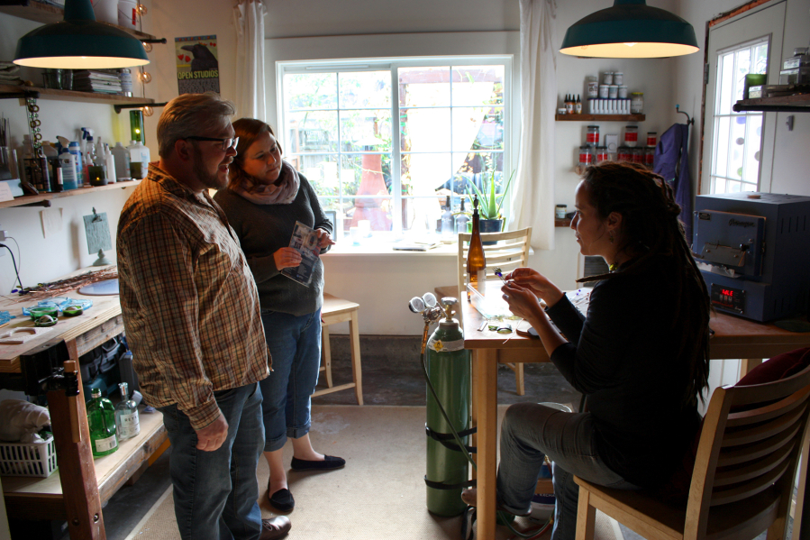 Glass artist Ariel Young greets visitors during a recent Open Studios tour.