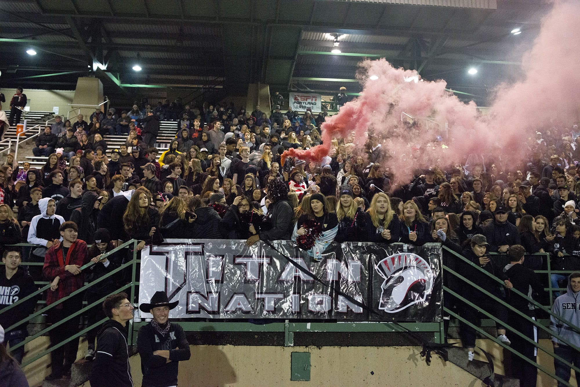 The Union student section lets off a smoke flare before a 4A playoff game against Tahoma at McKenzie Stadium in Vancouver on Friday, Nov. 3, 2017. Union beat Tahoma 41-14.