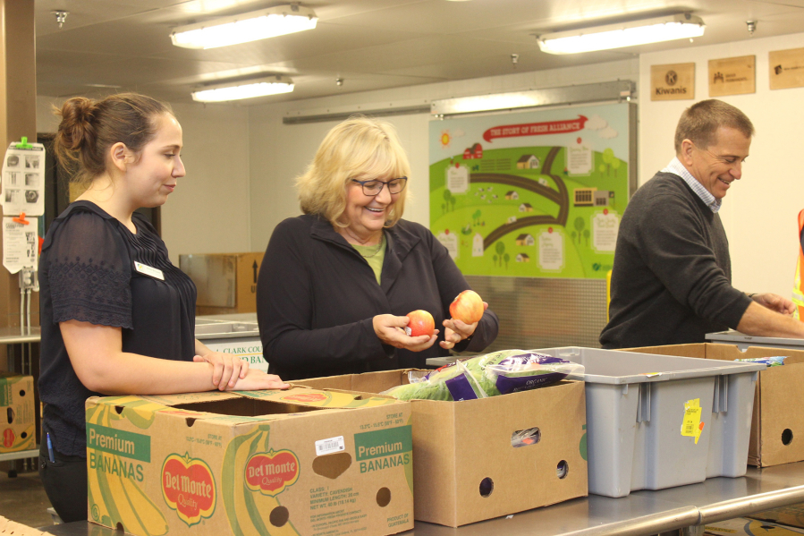 Minnehaha: Trudi Inslee, the state’s first lady, visited the Clark County Food Bank on Oct. 24, helping volunteers pack boxes and prepare ingredients.