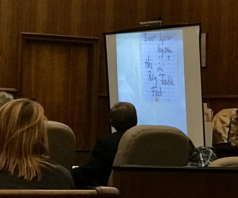 Prosecutors show the jury in Brent Luyster’s triple murder trial a note scribbled by surviving shooting victim, Breanne Leigh, identifying Luyster as her assailant, Monday in Clark County Superior Court.