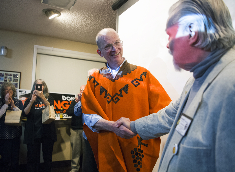 Don Orange shakes hands with Douglas Canoose at the Vancouver Firefighters Local 452 in Fruit Valley while receiving congratulations from a large crowd for leading the race for a seat on the Port of Vancouver Board of Commissioners, against his opponent, Kris Greene.