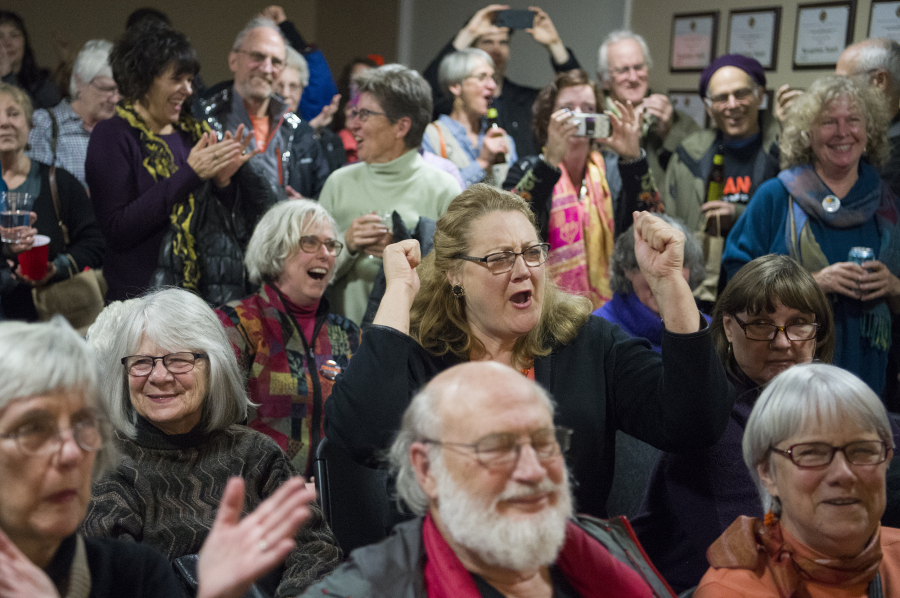 Don Orange supporters cheer after hearing an announcement that Orange was leading the race for a seat on the Vancouver Port District Commission, Tuesday November 7, 2017, at Vancouver Firefighters Local 452 in Fruit Valley.