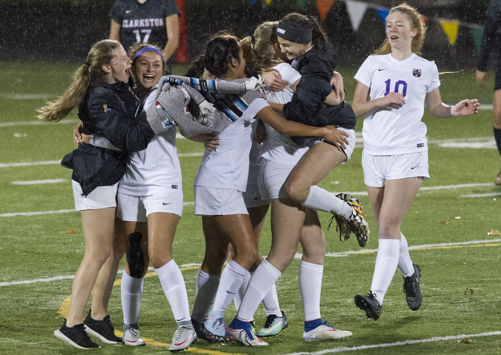 Columbia River girl’s soccer players celebrate after winning the first round of the class 2A girls soccer state playoffs, beating Clarkston 2-1, at Kiggins Bowl in Vancouver, Wednesday November 8, 2017.