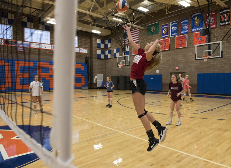 Anika Nicoll spikes the ball during practice at Ridgefield High School as the Spudders get ready for the 2A state tournament this weekend.
