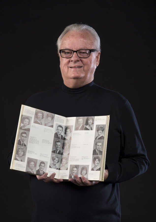 Vancouver resident Gary Phillips with his 1964 high school yearbook. Phillips was a senior at Bryan Adams High School in Dallas in 1963, and watched the presidential motorcade go by just before John F. Kennedy was assassinated.