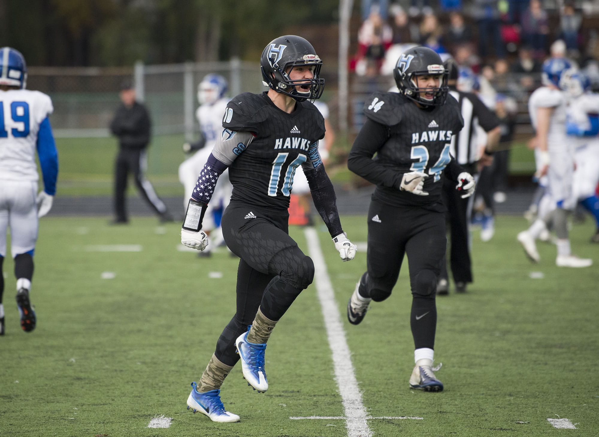 Hockinson’s Kyle Brabec (10) celebrates after a teammate scored a touchdown during the class 2A state playoffs against Pullman at Battle Ground District Stadium, Friday November 10, 2017.