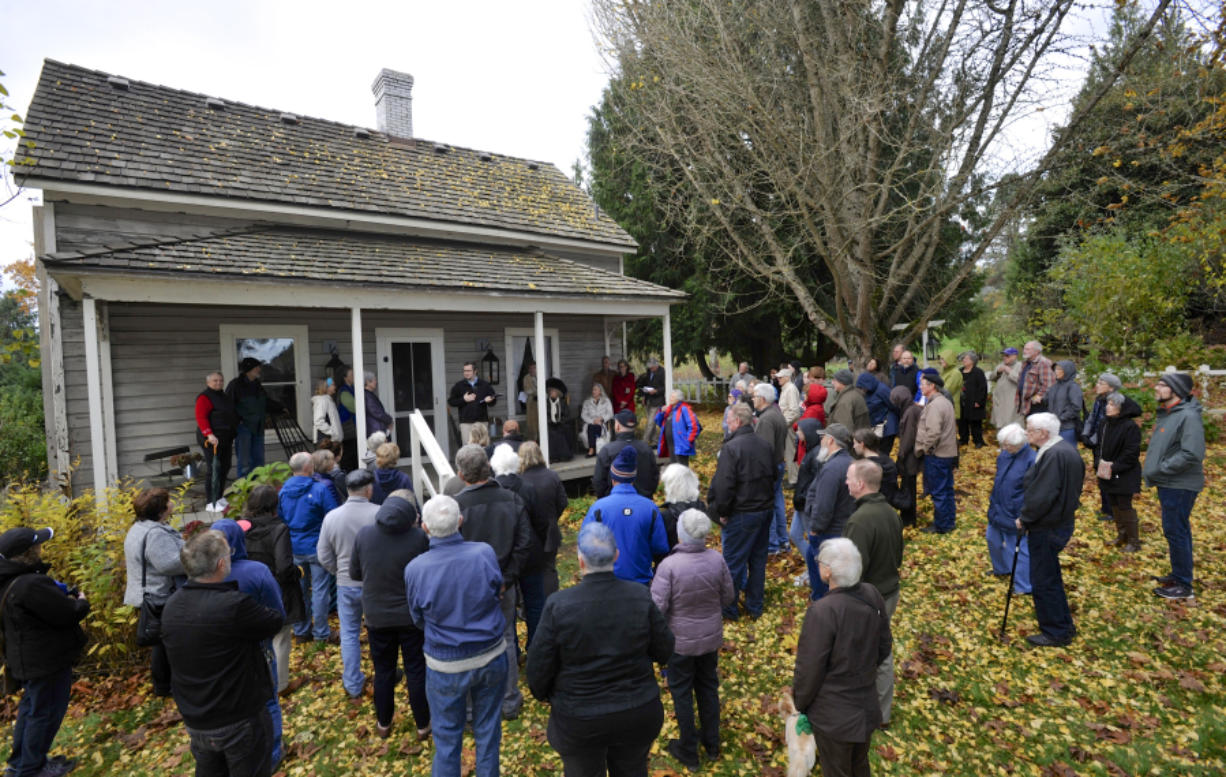Guests gather to hear speakers at the 150 anniversary celebration for the John Stanger House, the oldest privately built home in the county Sunday.