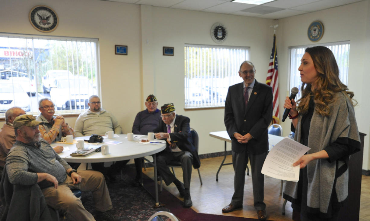 U.S. Rep. Phil Roe, R-Tenn., right of center, and Rep. Jaime Herrera Beutler speak with veterans about VA wait times.