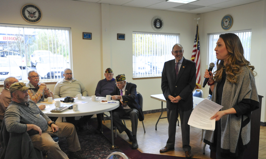 U.S. Rep. Phil Roe, R-Tenn., right of center, and Rep. Jaime Herrera Beutler speak with veterans about VA wait times.