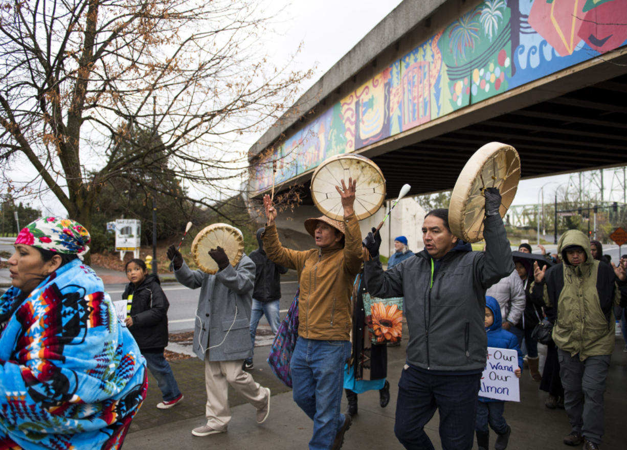 Native American tribal members and environmental activists marched through Vancouver on Saturday to protest sewage spills into the Columbia River.