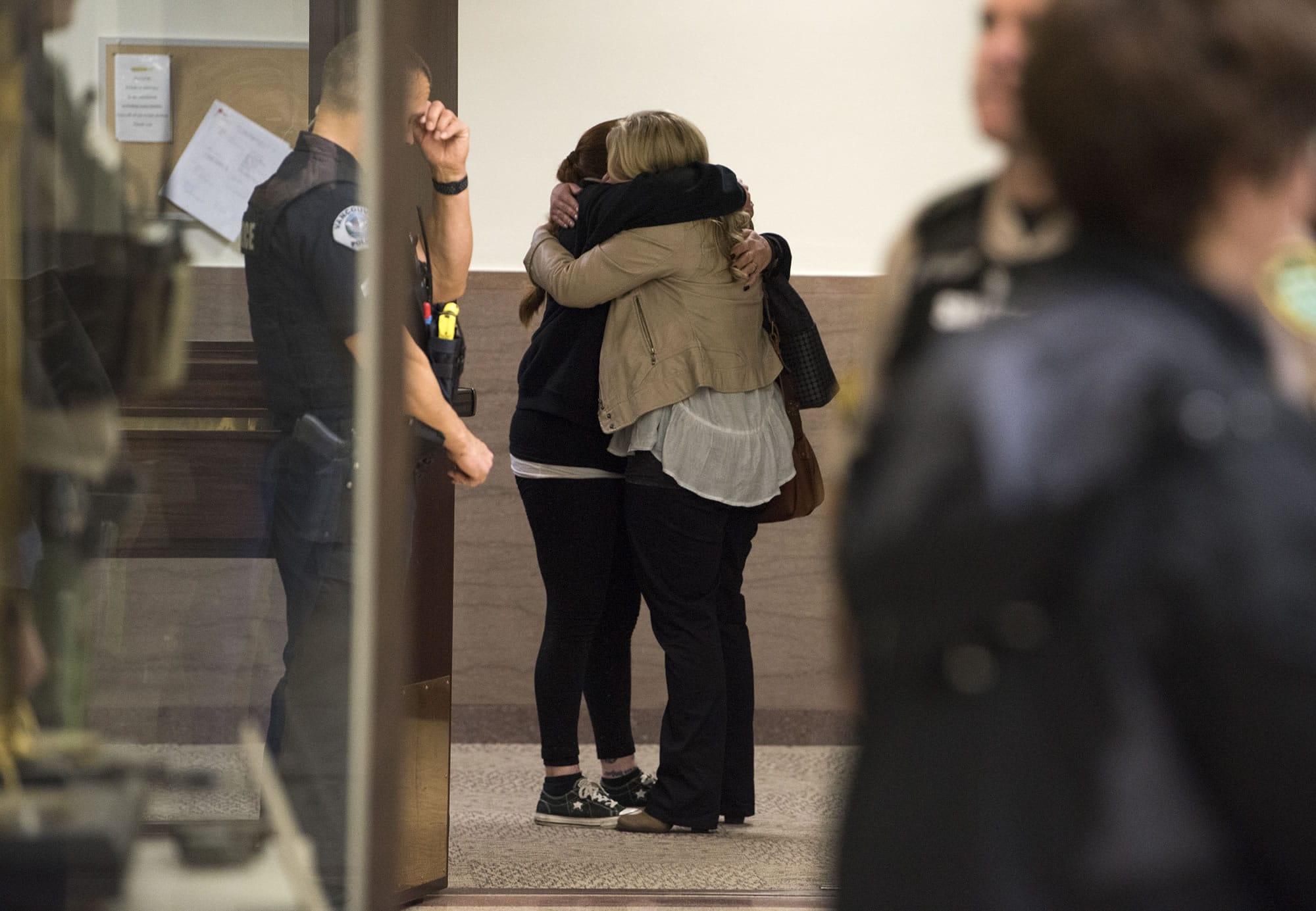 Abia Nunn embraces Heidi Gowing after Brent Luyster was found guilty on all counts in a triple aggravated murder trial in Clark County Superior Court, Friday morning, Nov. 17, 2017. Nunn is the sister of Joseph Mark Lamar, whom Luyster was found guilty of fatally shooting.