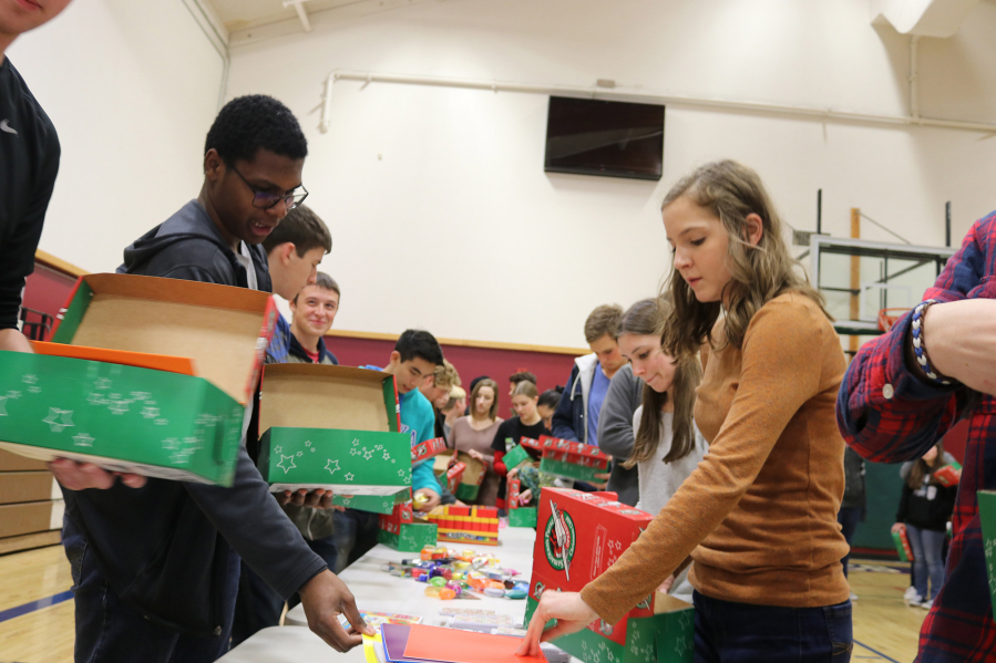 Battle Ground: Elementary through high school students at Firm Foundation Christian School spent part of their Halloween packing boxes full of supplies for children overseas.