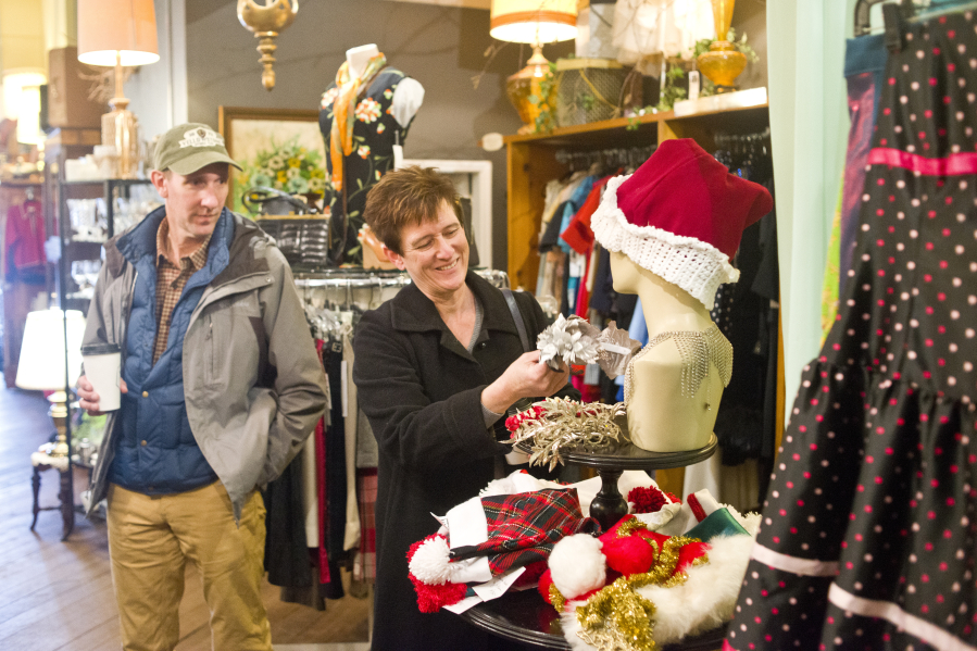 Tom and Alisa Brossia shop at Most Everything Vintage on Saturday in downtown Vancouver to support the Small Business Saturday movement. The campaign, launched in 2010 by American Express, encourages people to shop local the day after Black Friday.